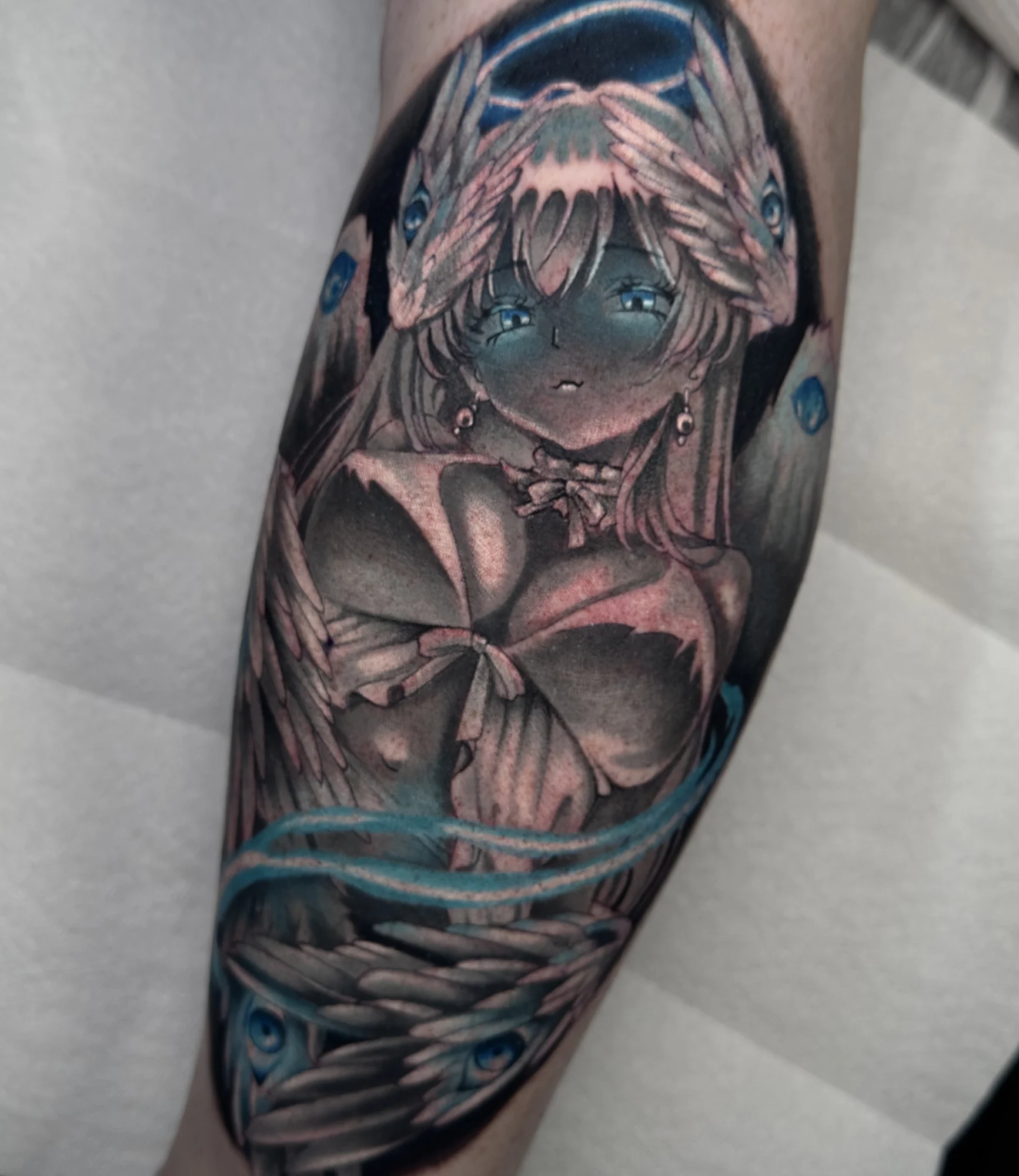 Anime Seraphim tattoo in Black and Grey with a dash of blue color